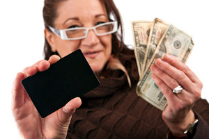 middle-aged-woman-carefully-trying-to-decide-between-using-old-fashioned-cash-or-a-plastic-credit-card_BKPERvCSj_thumb.jpg