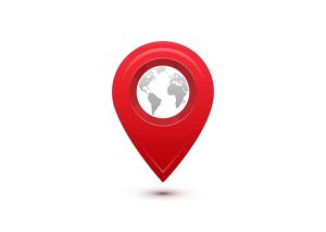 A red pin with a globe on it.